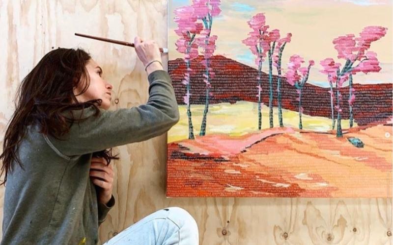 Sara Winfield painting her Dreamscape artpiece that features on the Dune Distilling Co Signature Gin